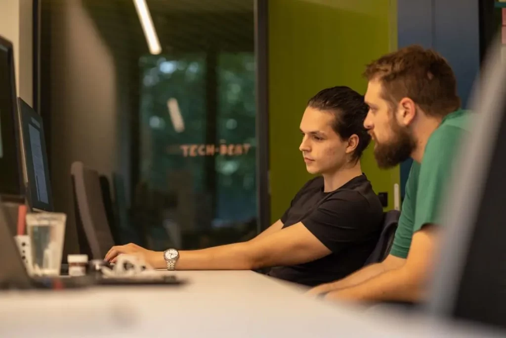 Kustodian developers in front of the laptop