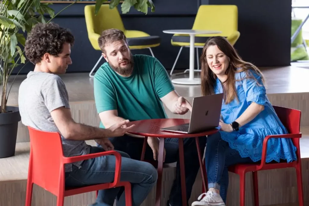 Kustodian developers around a laptop